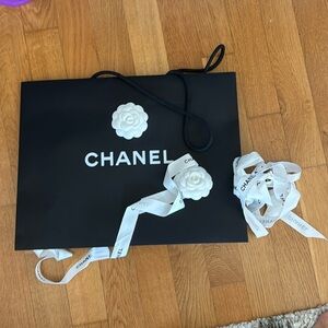 chanel shopping bag with two gift ribbons
